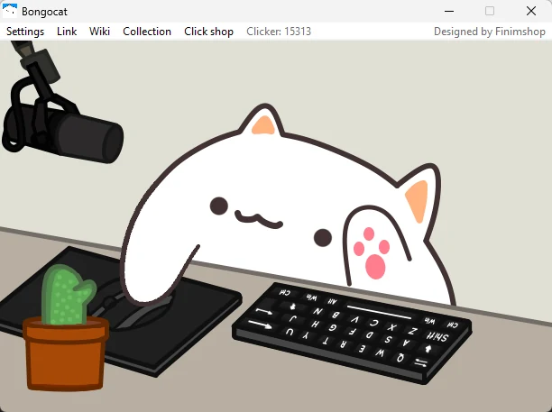 La fenêtre de Bongocat : le chat blanc, pattes sur le clavier et la souris, à côté d’un micro et d’un cactus